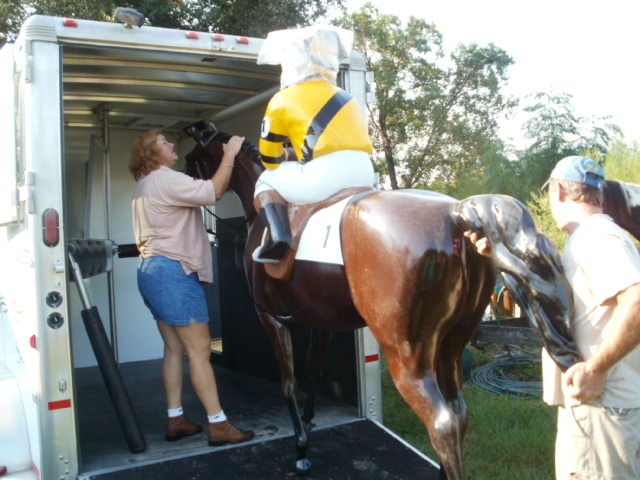 Loading them up...well trained horses!